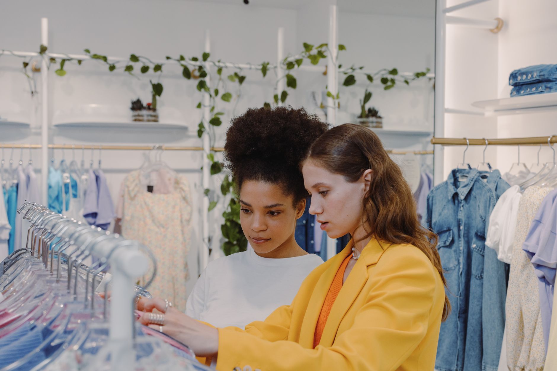 Interior of a women's clothing retail store with apparel on racks