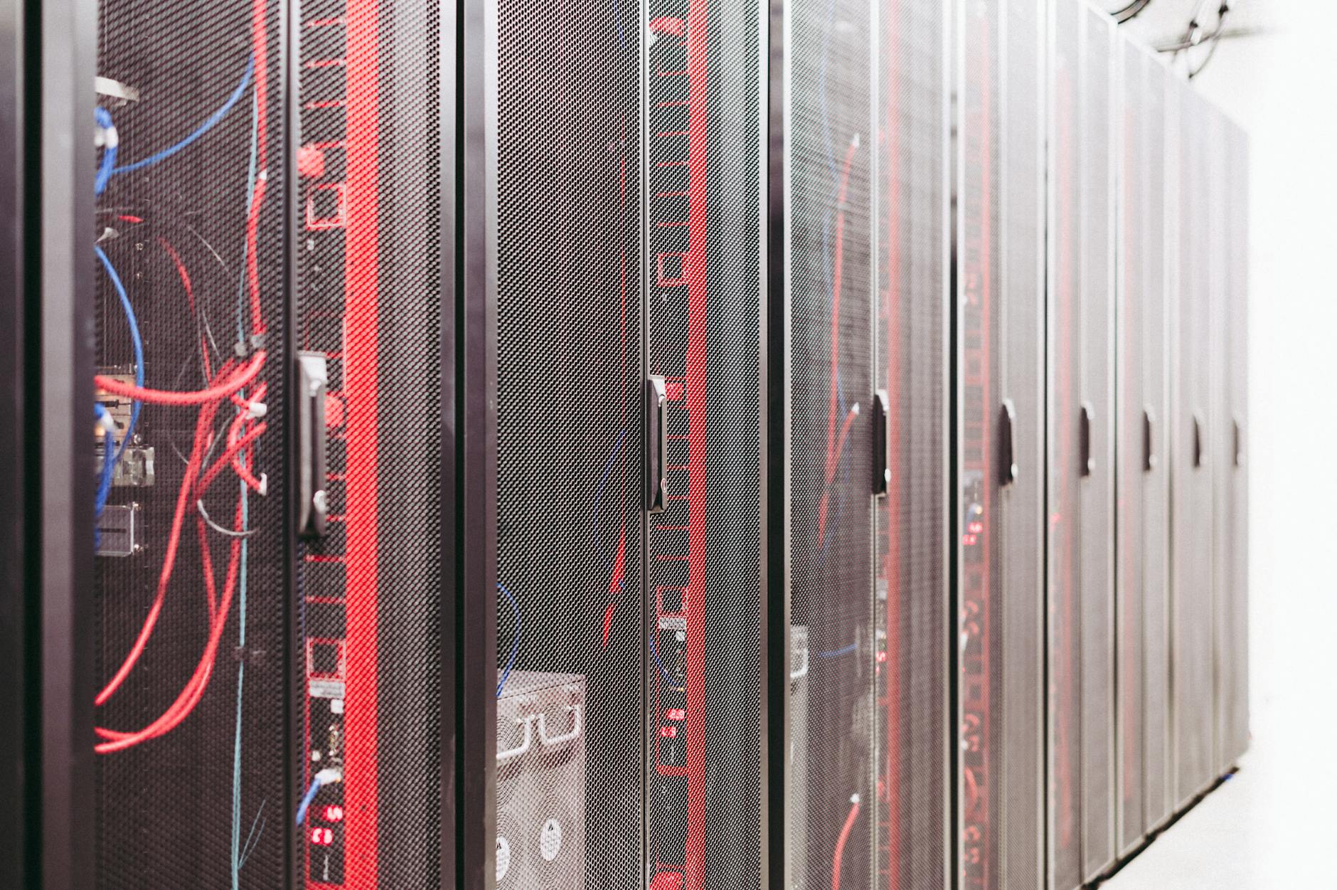 Rows of server racks in modern data center facility