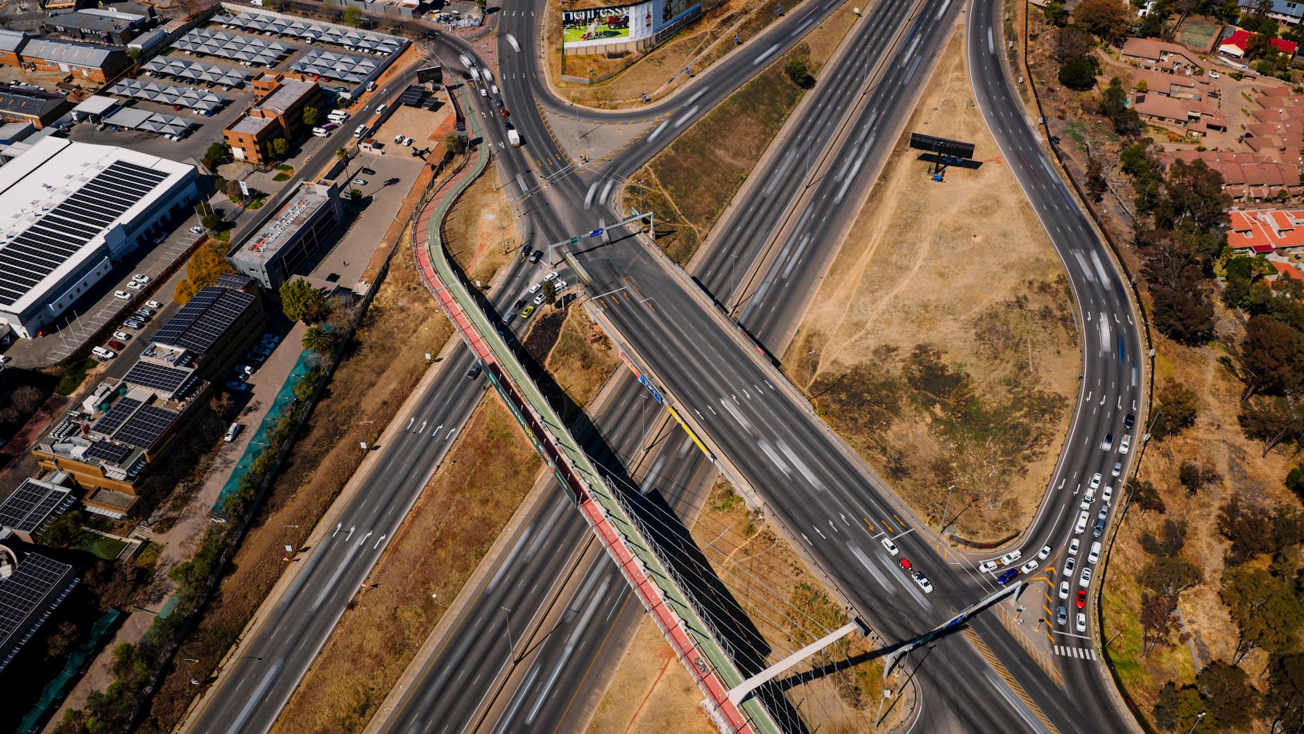 Light poles and highway infrastructure near transportation hub
