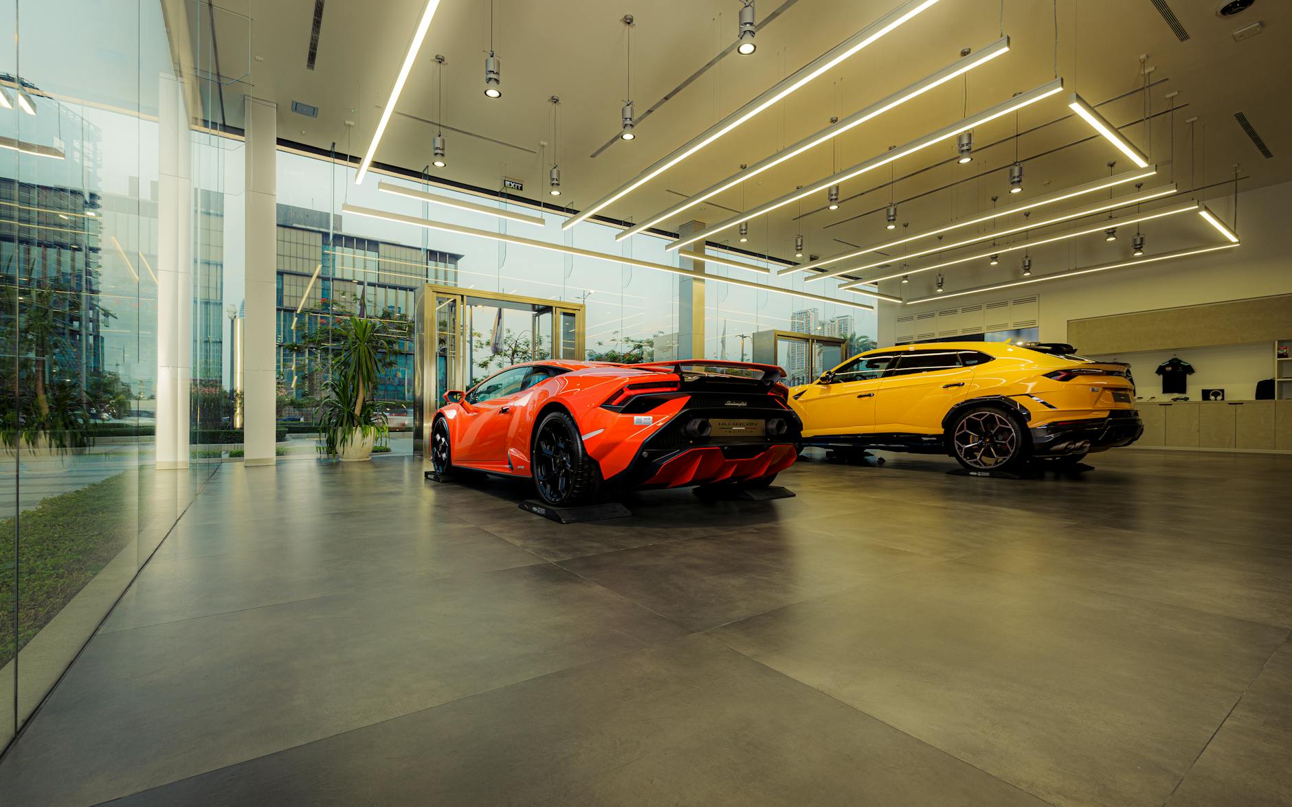 Multiple vehicle variants displayed in modern automotive showroom