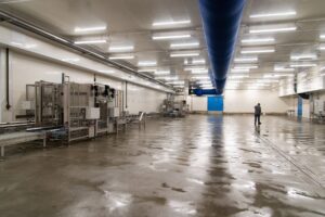 Industrial robotic arms operating on a factory floor