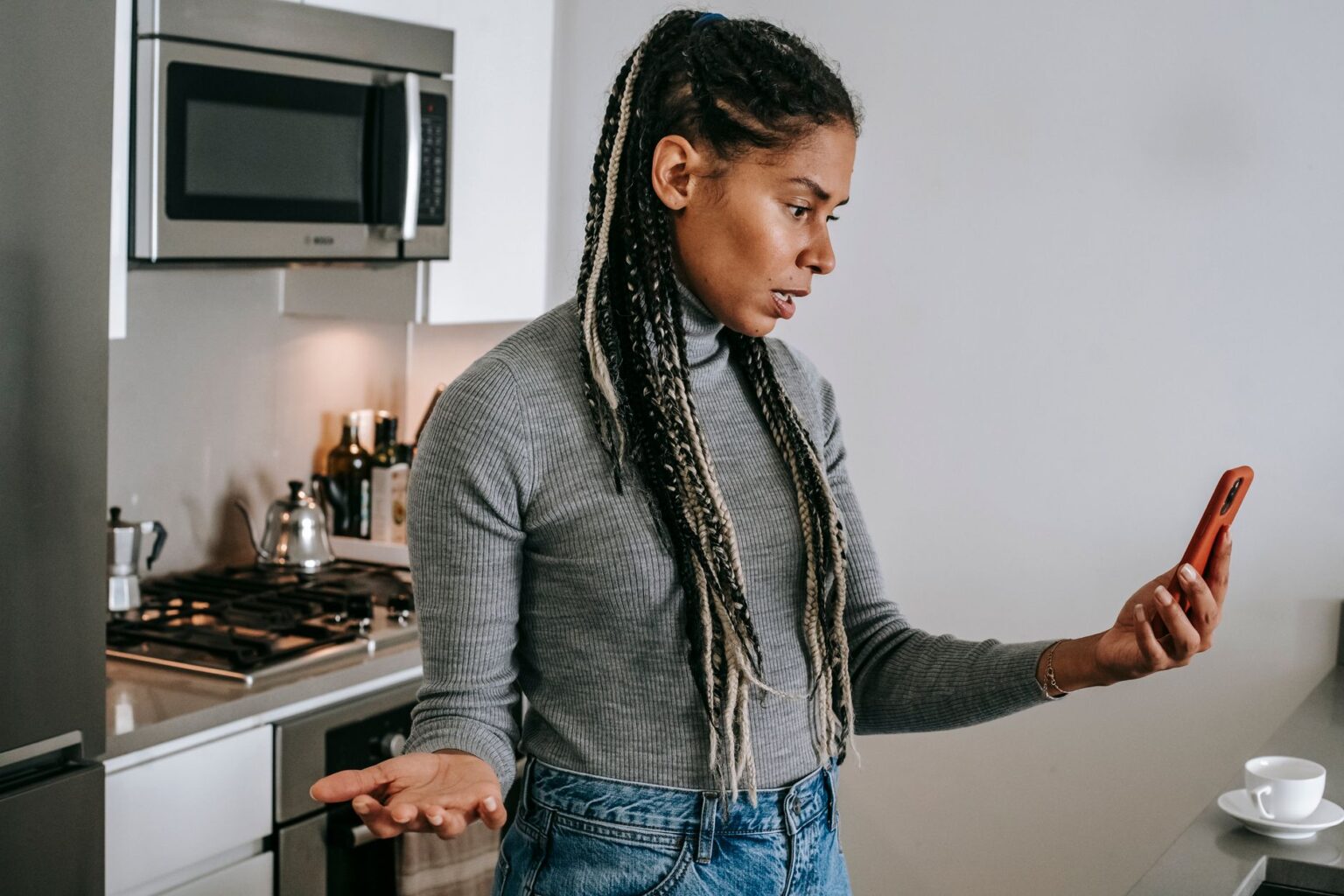 Person looking concerned while receiving messages on a smartphone