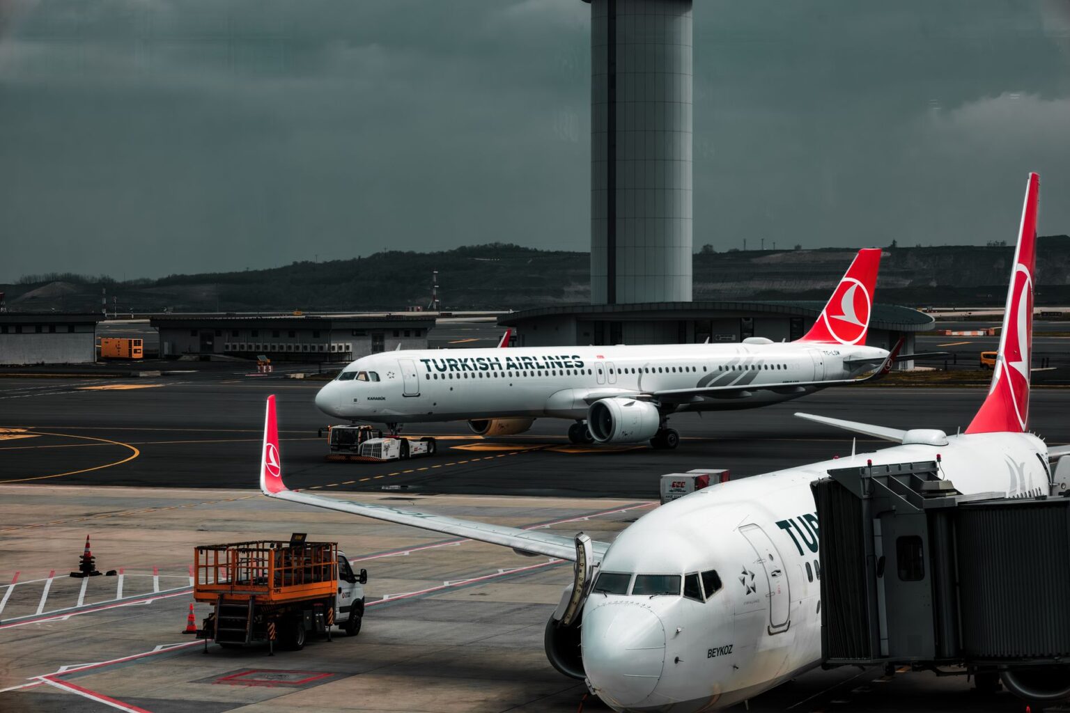Wide-body commercial aircraft on airport runway during daytime
