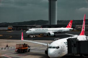 Wide-body commercial aircraft on airport runway during daytime