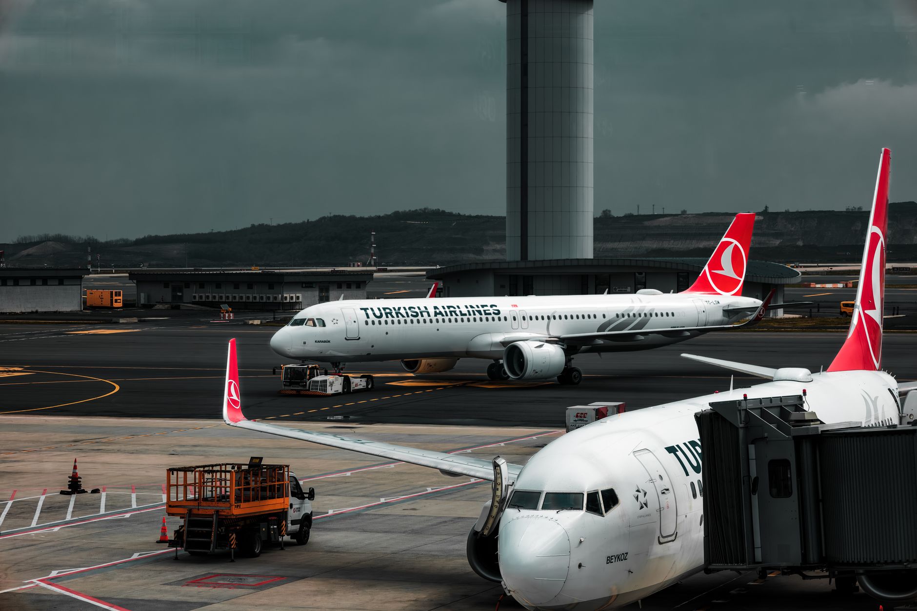 Wide-body commercial aircraft on airport runway during daytime
