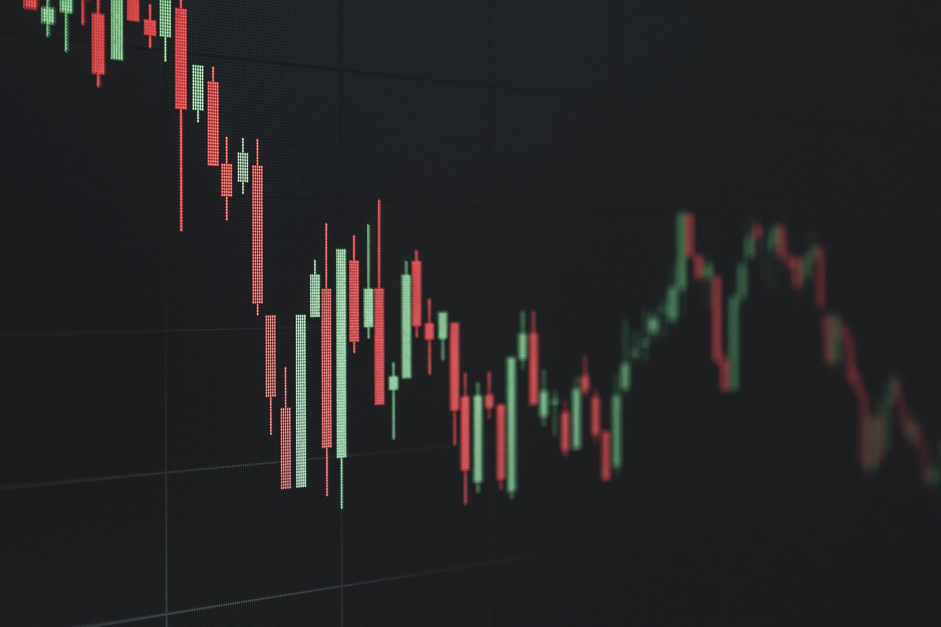 Stock market board showing declining tech sector prices during a volatile trading week