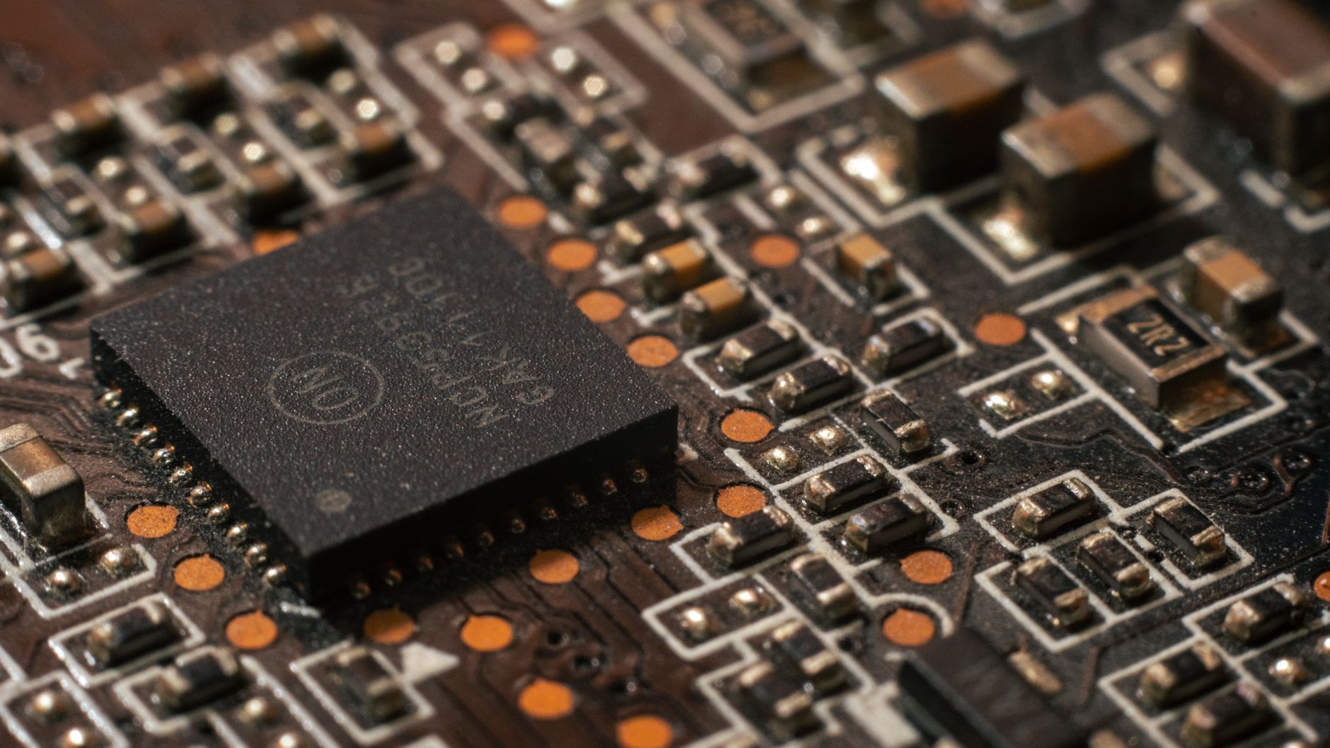 Close-up of semiconductor chip representing Intel and technology sector stocks