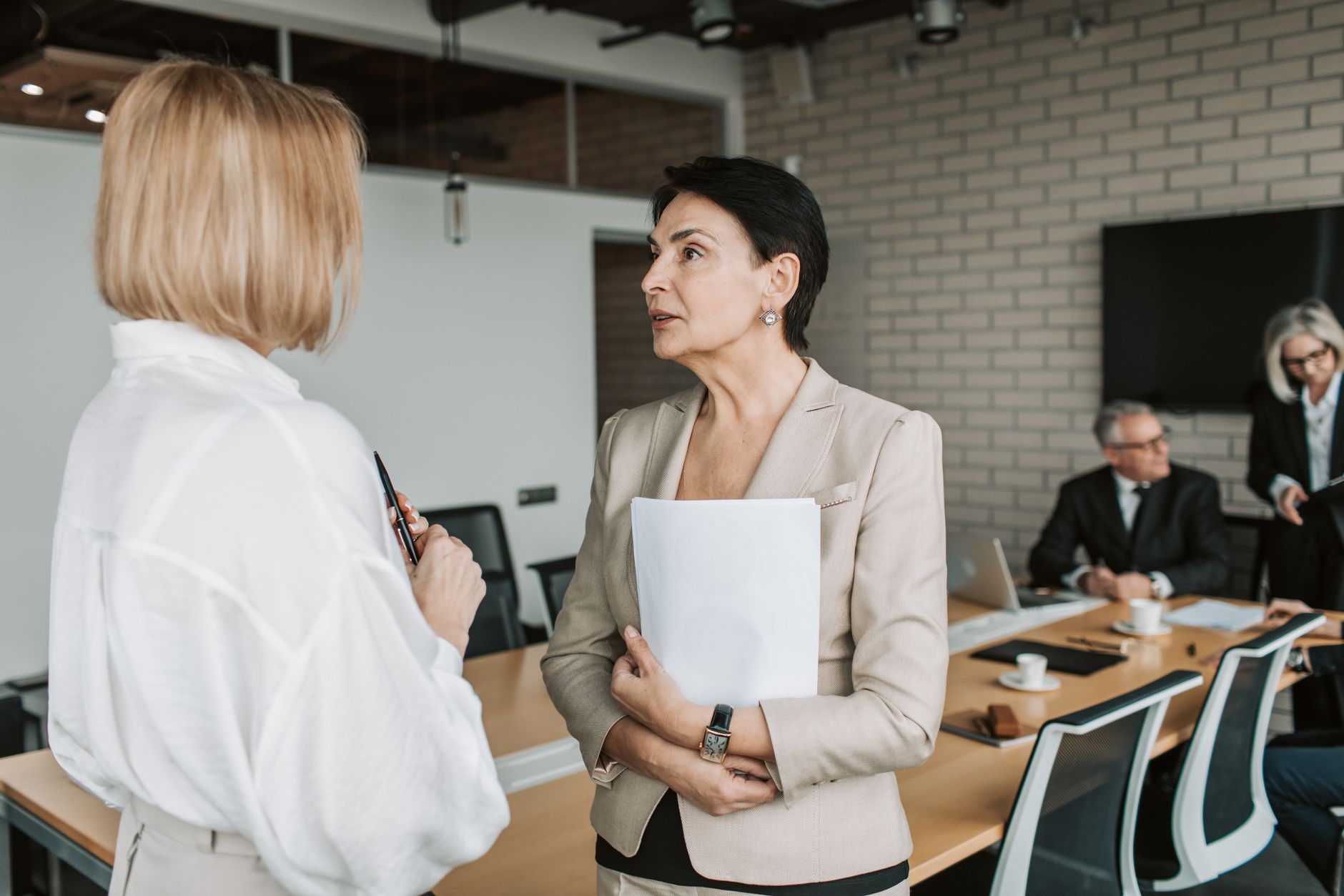 Business executives in a meeting room during corporate negotiations