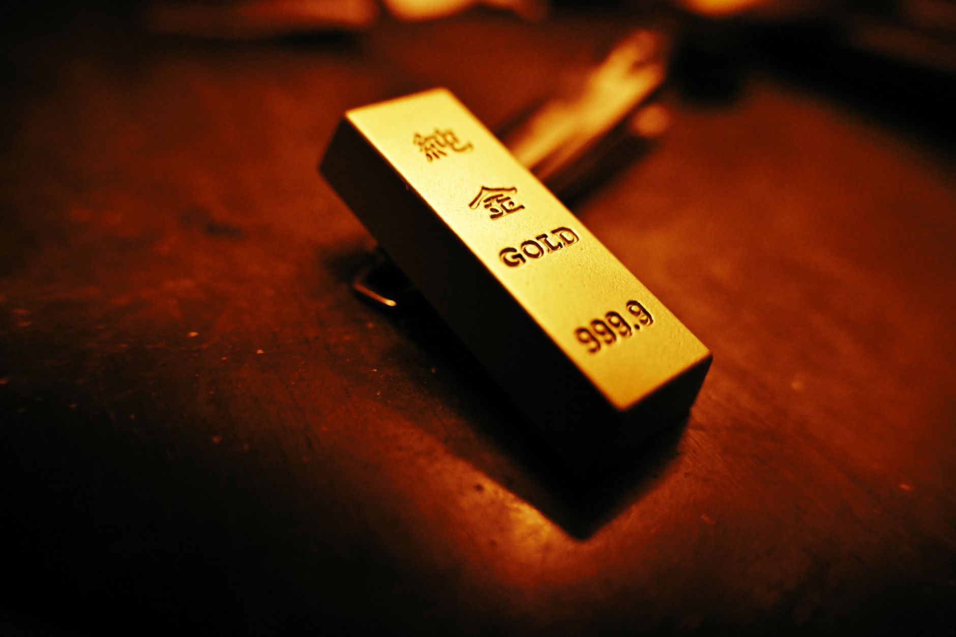 Stacked gold bars representing rising gold prices amid geopolitical uncertainty