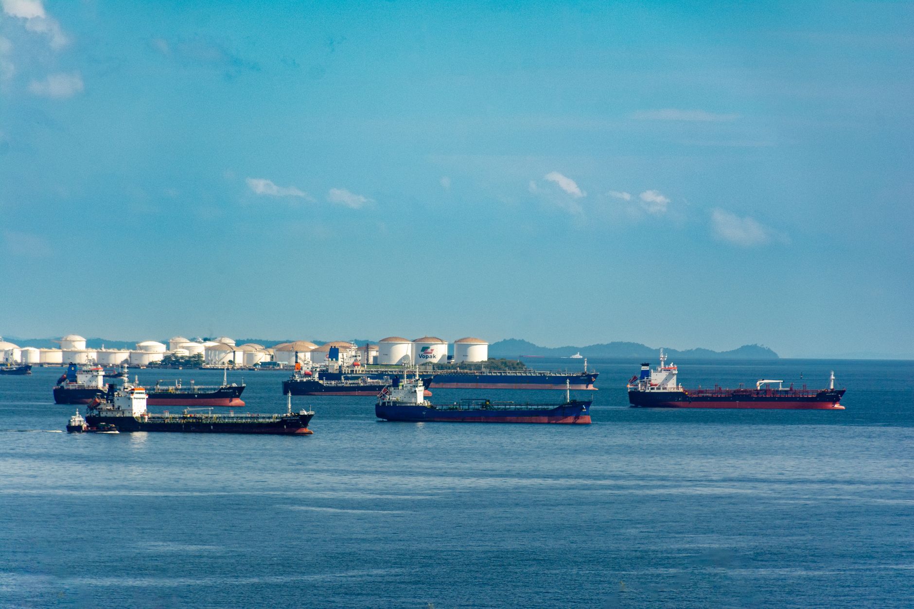 Large oil tanker vessel crossing open sea near strategic shipping route