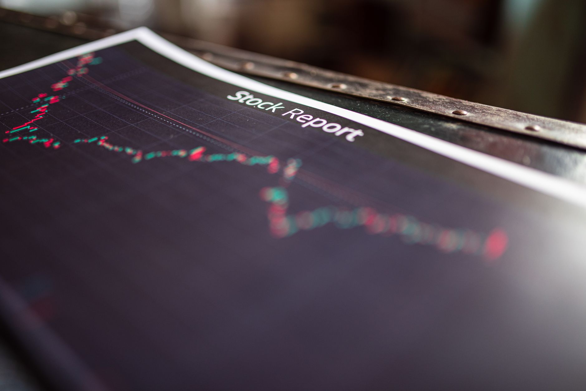 Financial charts showing market volatility on a trading monitor