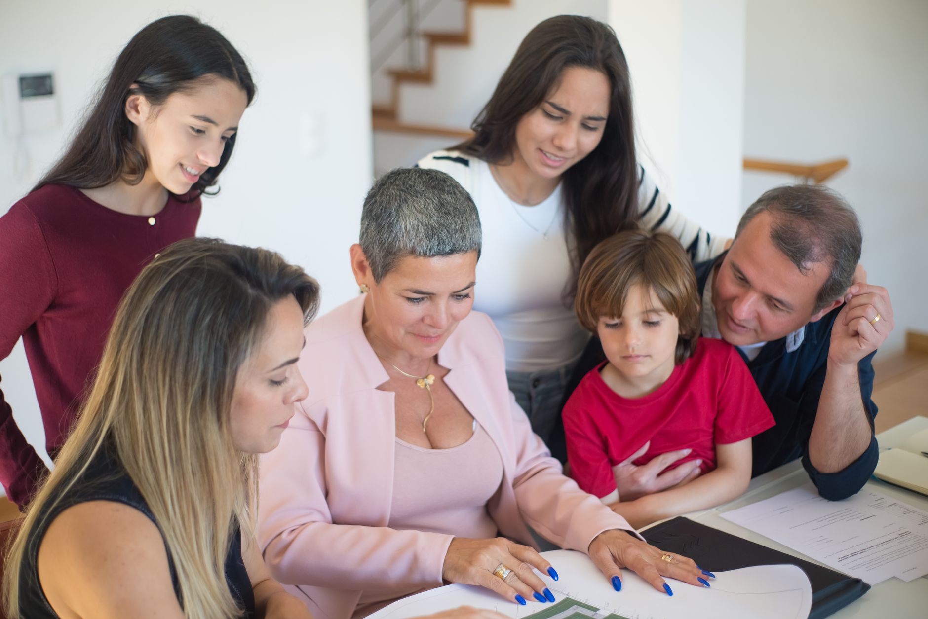 A parent and child reviewing financial documents together