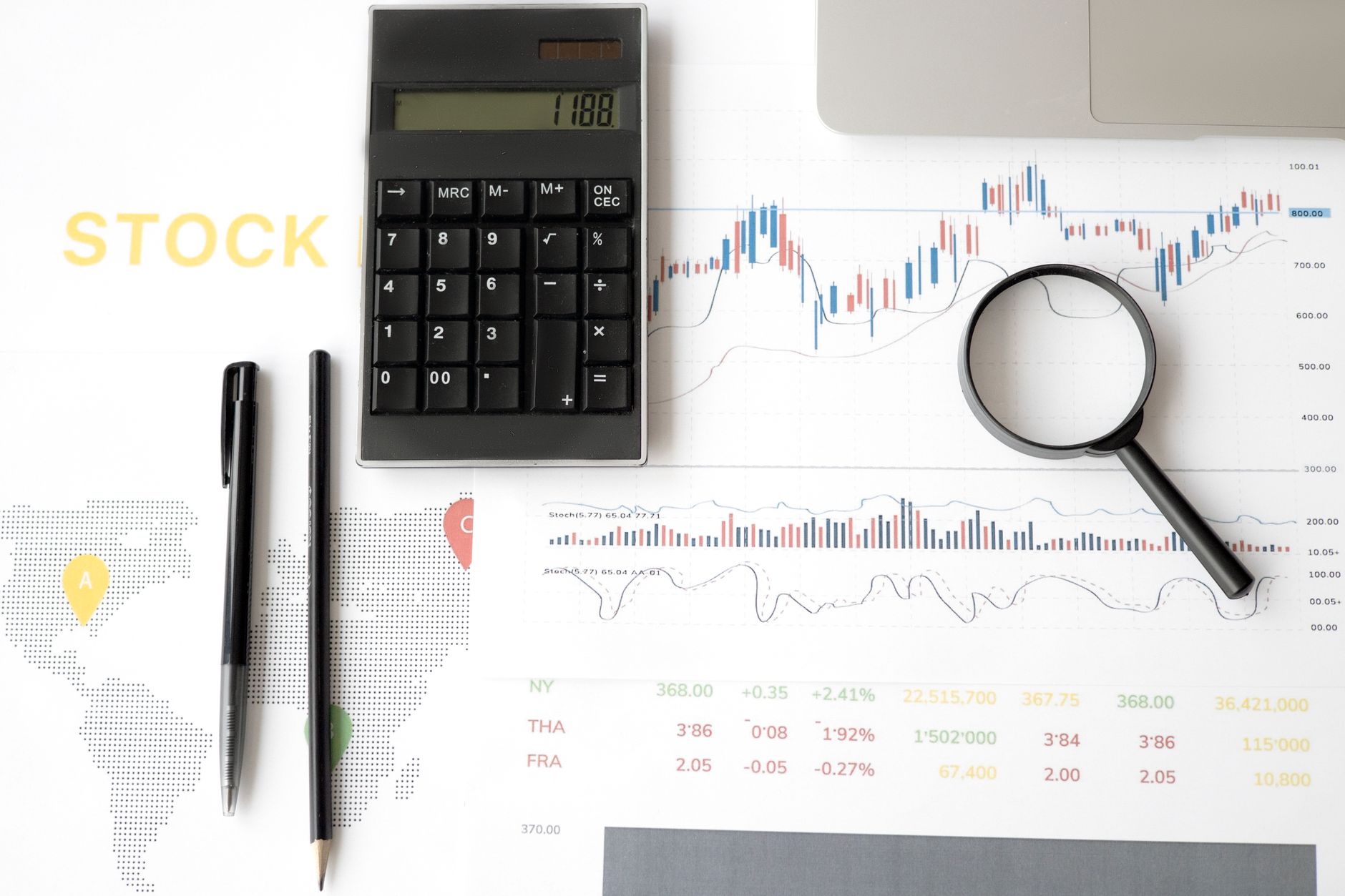 Financial analyst reviewing earnings charts and market data on a monitor