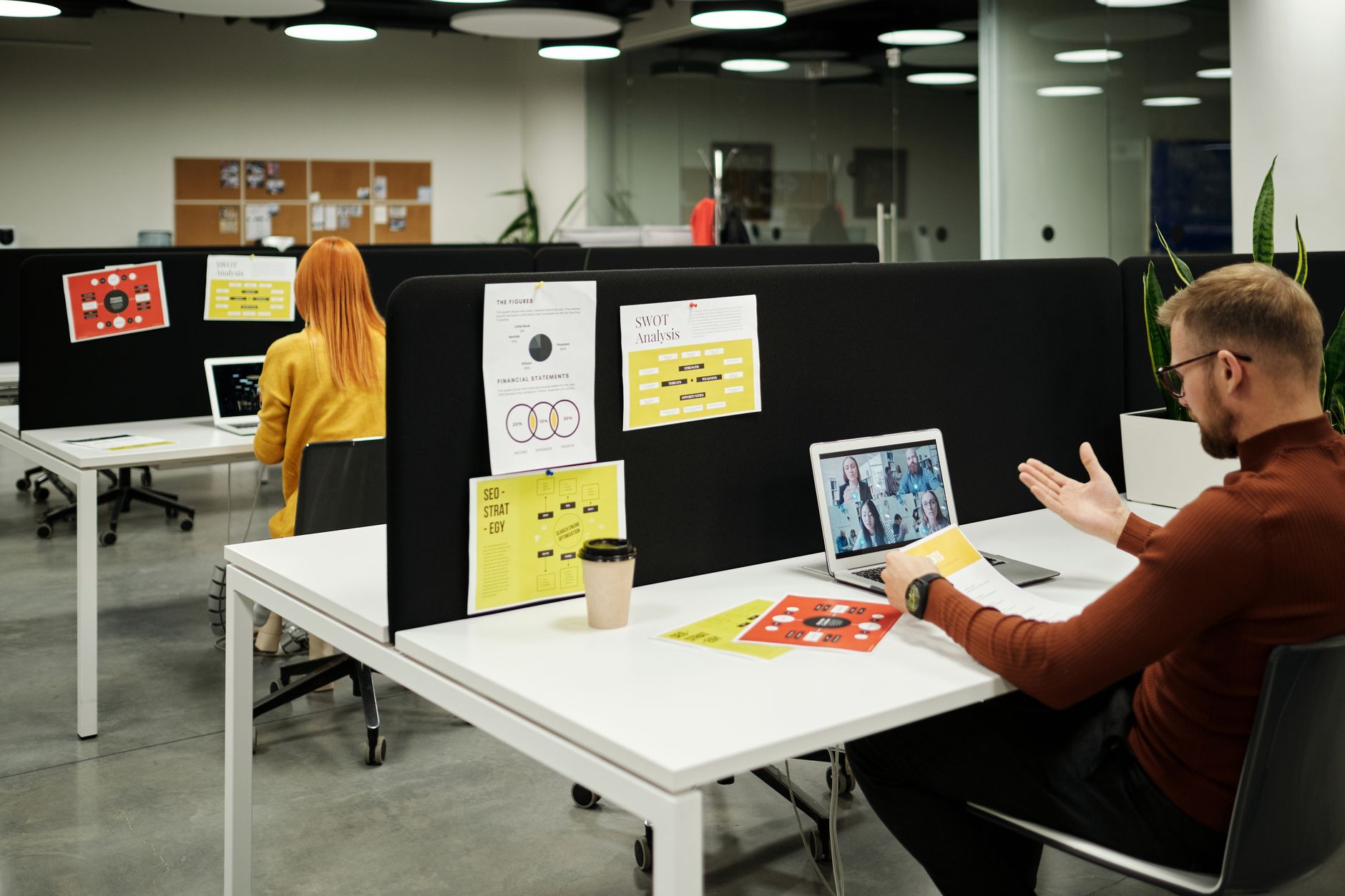 Business professional reviewing financial data on a computer screen in a modern office