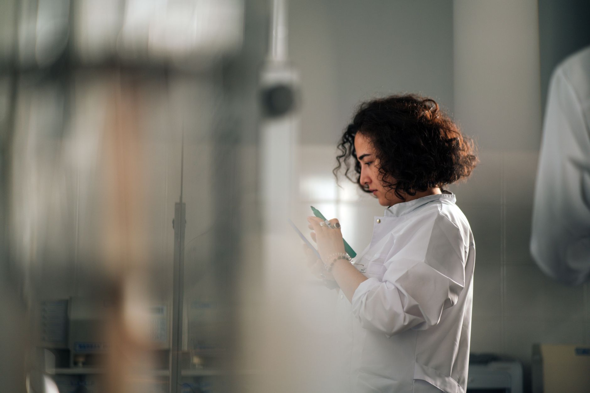 Pharmaceutical researcher working in a lab, representing pharma sector ETF focus