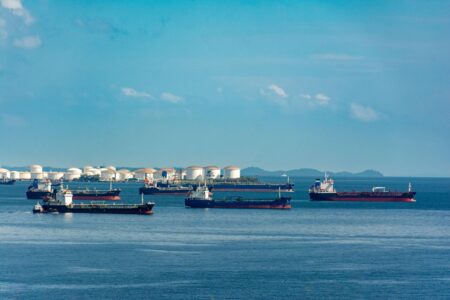 Large oil tanker crossing open ocean waters under overcast skies