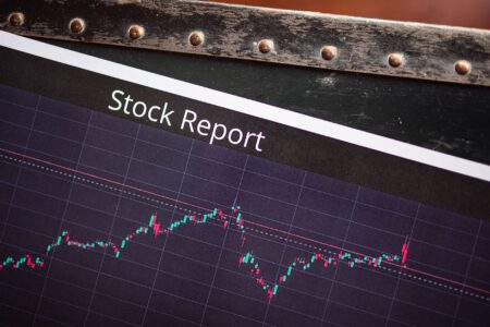 Trader watching stock market screens during a volatile session