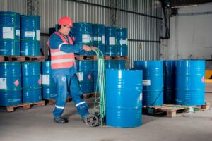 Rows of oil storage barrels at an industrial facility