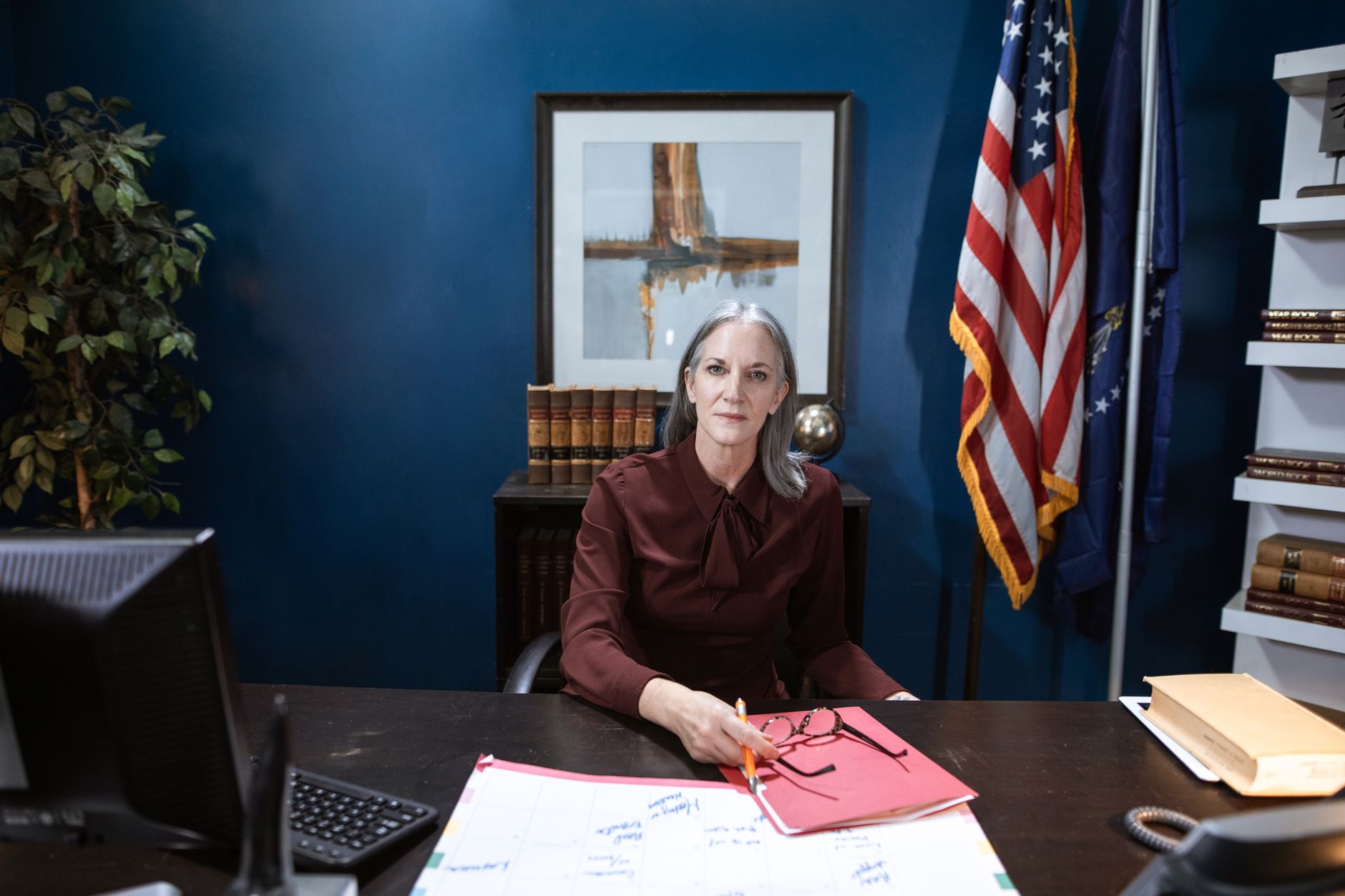 Government official's desk with papers and an office chair