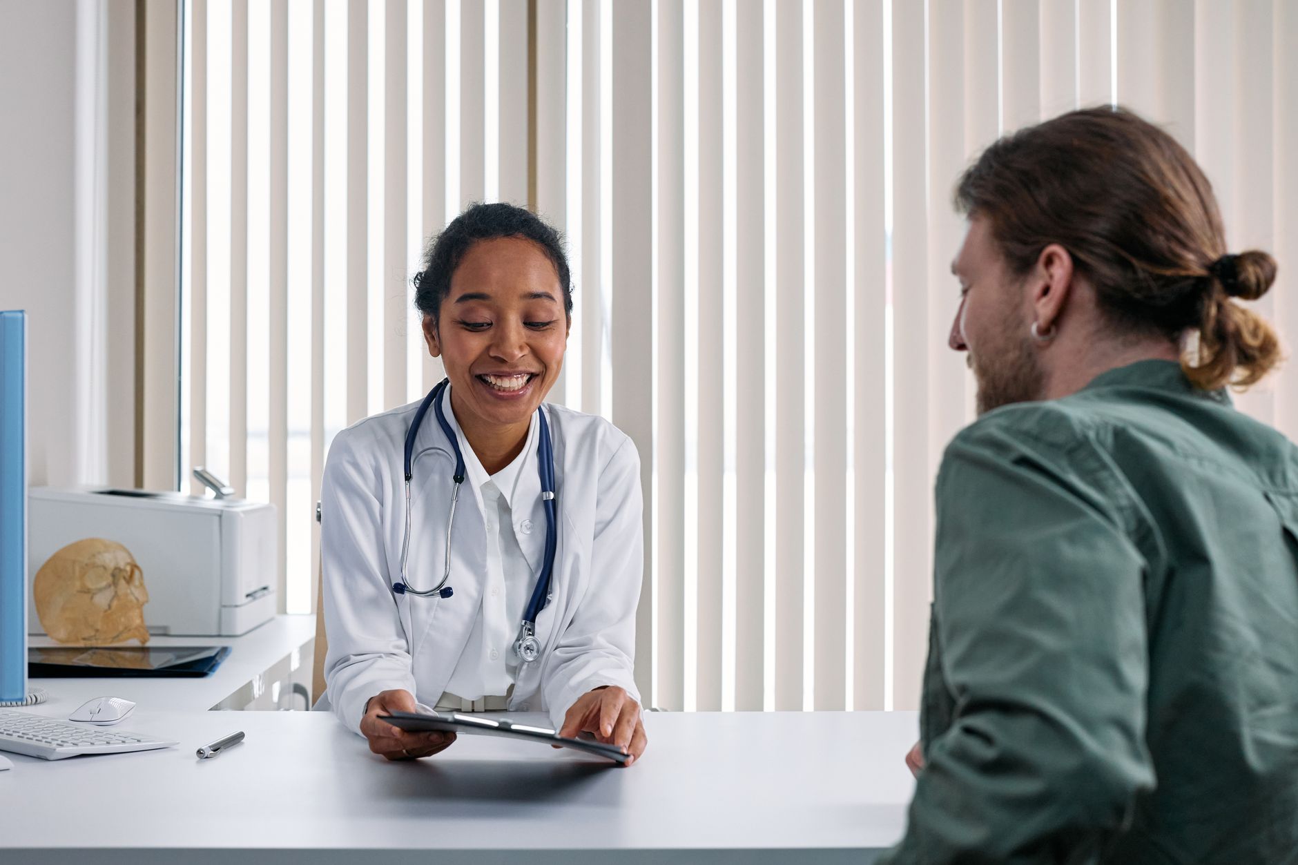Doctor discussing treatment options with a patient during a medical consultation