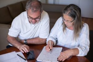 Person reviewing retirement income planning documents at a desk
