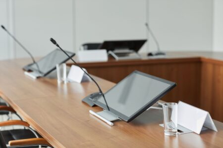 Corporate boardroom representing a major media acquisition deal