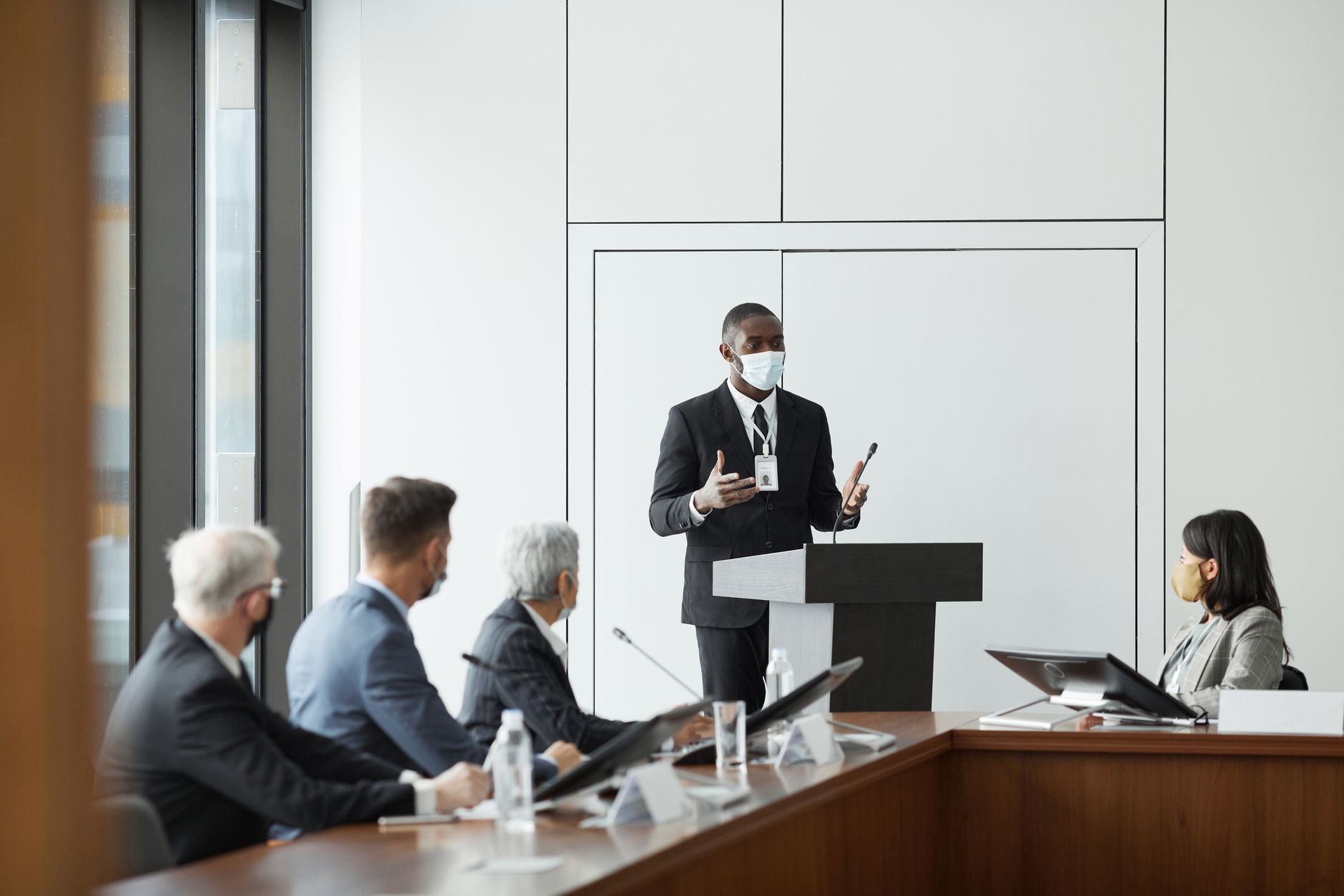 Business professionals reviewing compliance documents related to AI regulation